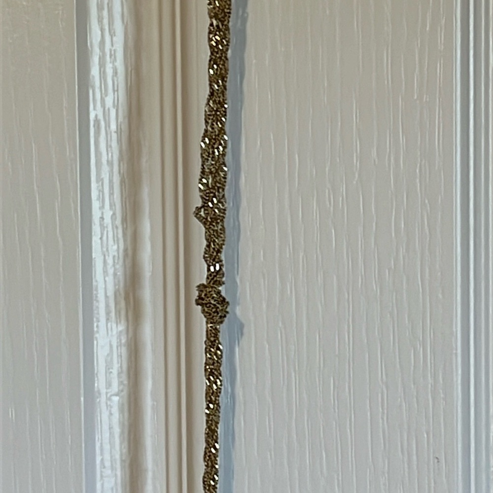EUC gold-colored “knotted” necklace